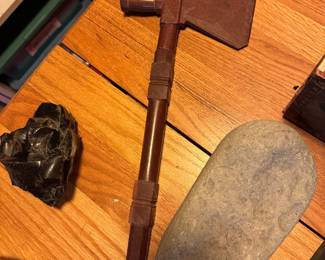 native American ceremonial pipe. in showcase with employee