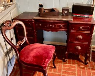Six drawer antique desk with carved pulls  with chair