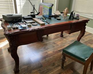 Carved desk with green leather top