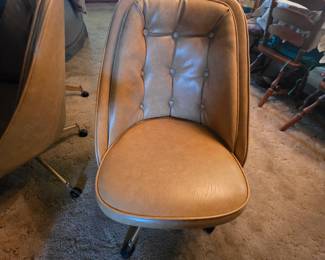 Mid century modern bucket dining chairs on wheels
