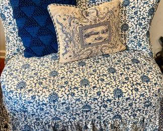 Sweet blue and white covered chair.