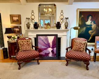 Living room full of fine art, decor, and furniture.