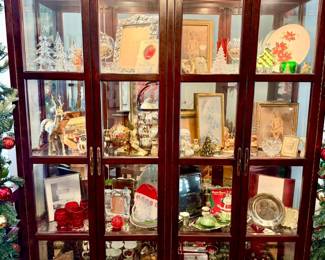 Large lighted china cabinet.