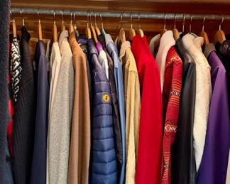 Another closet with more jackets and coats.