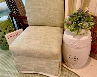 Slipper chair in green and white.