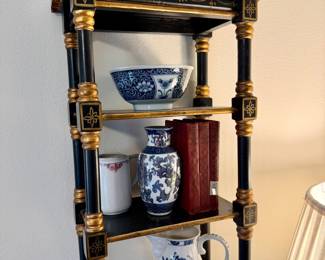 Lots of blue and white chinoiserie. Pair of black and gold pagoda shelves.