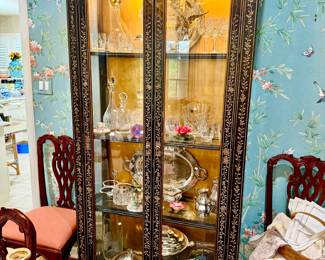 Exquisite vintage black lacquer and gilded lighted curio full of Waterford and silver.
