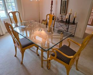 Hollywood Regency-style dining set features a glass-top table with a yellow-painted faux bamboo frame and matching chairs with striped upholstered cushions.  Perfect condition!