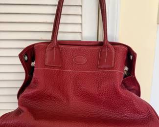 Tod's Girelli Red Leather Tote, a classic piece known for its understated luxury and Italian craftsmanship. Bag is crafted from durable pebbled leather (often referred to as "grain leather") and features distinctive white contrast stitching and silver-tone hardware