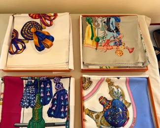 Hermès Carré 90 silk scarves, each featuring a unique heritage design. These 90cm square accessories are renowned for their 100% silk twill material, hand-rolled edges, and intricate storytelling motifs designed by various artists.