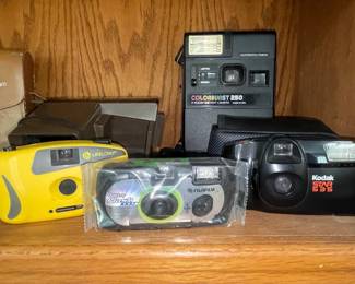 Assorted Vintage Point-and-Shoot Cameras: Kodak Colorburst 250, Fujifilm QuickSnap Flash 1000, Kodak Star 335, and Lifelong