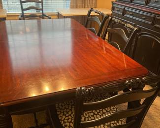 brown/black wood dinning table w/ 2 leaves not in -in the picture - so it gets bigger buffet /hutch that matches 6 or 8 chairs