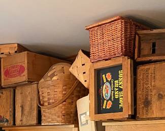 Lots of baskets, wooden crates and containers.