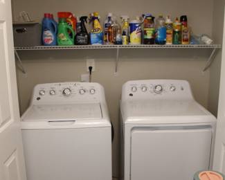 Washer and dryer set, laundry appliances, top load washing machine, electric dryer, laundry room setup, white washer dryer set, household appliances Laundry room organization, laundry shelf storage, utility room, washer dryer closet, compact laundry space Laundry detergent, fabric softener, Gain detergent, Downy fabric softener, Tide pods, laundry supplies Cleaning supplies, household cleaners, disinfectants, Pine Sol, Lysol wipes, glass cleaner, multi surface cleaner Zep cleaner, Method cleaner, Dawn dish soap, spray cleaners, home cleaning products Laundry essentials, home essentials, cleaning products lot, household goods, estate sale items Utility shelf, wire shelving, storage solutions, home organization Estate sale appliances, working washer dryer, home furnishings, complete laundry setup