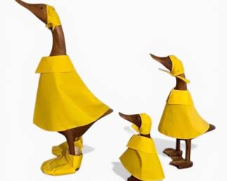 Three Wooden Ducks in Raincoats
