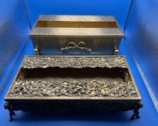 Brass tissue boxes.