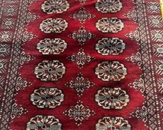 Large wool woven area rug. Elephant feet design. 