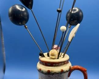 Hat pins and holders.