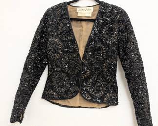 An 80's vintage Oscar de La Renta black sequined jacket; from Loretta Blum, top fashion retailer in Dallas, Texas
