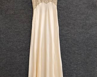 A vintage 1940s nightgown with lace accents, silk or a silk rayon mix