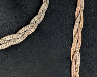 Closeup of the two sterling silver braided herringbone chain necklaces