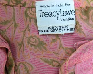 Inside tag of the vintage '70s Treacy Lowe peach and pink print 100% silk long sleeved smocked dress 