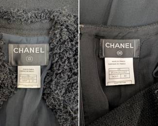 Closeup of the 2003 vintage classic Chanel black boucle wool suit, the jacket and skirt both edged with a looped wool, the jacket closes at the neck with a black camellia flower button; jacket size 42 and skirt size 40.