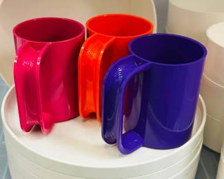 Closeup of vintage mid-century plastic serving ware, dish ware, and other items including pieces by Danese Milano (Italy), Gustavsberg (Sweden), Florineige, Heller, Dansk, and Fiskars Finland 