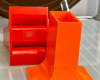 Closeup of vintage mid-century plastic serving ware, dish ware, and other items including pieces by Danese Milano (Italy), Gustavsberg (Sweden), Florineige, Heller, Dansk, and Fiskars Finland 