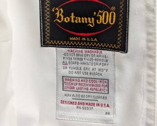 Closeup of Botany 500 women's ivory-color trench coat or rain coat