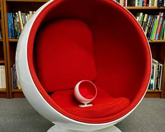 An Eero Aarnio-style ball chair (and with a miniature version of the chair!) Check out that classic 1960s design, a brilliant mid-century-modern example of futuristic and fun design that remains a pop icon classic.