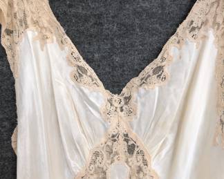 Closeup of a 1940s vintage nightgown with lace accents, silk or a silk rayon mix