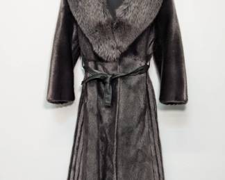 A seal fur long coat with fox fur shawl collar, inside label from the German company Fleiner in Recklinghausen.