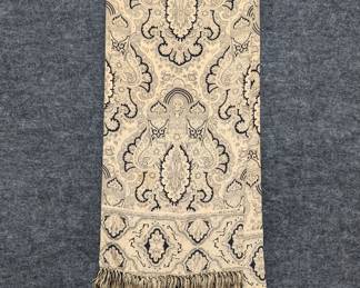 A vintage Echo shawl or scarf featuring a cream and black paisley damask pattern with fringed edges