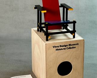A miniature collectible replica of the iconic Red and Blue Chair by designer Gerrit Rietveld, produced by the Vitra Design Museum, Miniature Collectibles