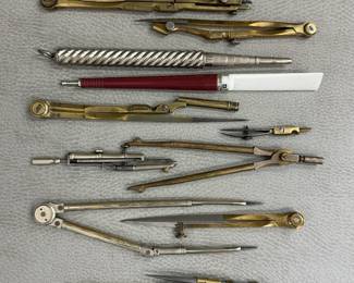 A collection of vintage drafting tools; various brass, silver, and nickel technical drawing instruments, compasses and ruling pens, late 19th to mid-20 century