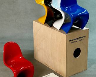 Miniature replicas of the iconic Panton Chair designed by Verner Panton, produced by the Vitra Design Museum as part of their Miniatures Collection