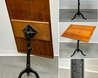 A vintage industrial drafting table featuring an adjustable oak top mounted on a heavy cast-iron tripod base made by Eugene Dietzgen Co.  of Chicago, IL. Wooden top is 36"L x 23-1/4"W.