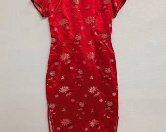 A stunning firecracker red silk floral brocade cheongsam or qipao dress.