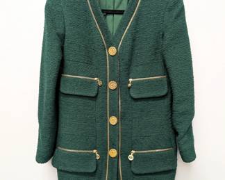 Chanel Boutique green jacket in signature bouclé wool with golden zippers and buttons