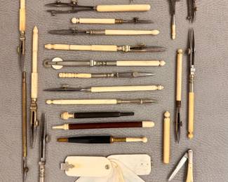 A wonderful collection of antique and vintage drafting and drawing tools, sewing needle cases, pocket knives, and a Victorian era  aide-mémoire or pocket calendar, often called a "dance card"