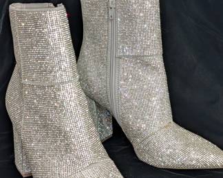 Step out in rhinestone dazzle from pointed toes to block heels with this pair of Madden Girl's Flex-R booties, size 7.5M