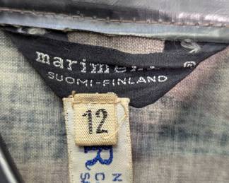 Closeup of Marimekko women's black and light brown abstract print rain coat or windbreaker, swing coat style, size 12, Finnish designer