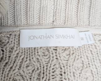Closeup of Jonathan Simkhai Anina stone fisherman knit fringe cardigan sweater size M