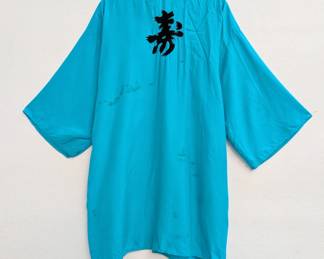 Reverse view of the vintage blue kimono style short robe with embroidered Chinese characters on front back