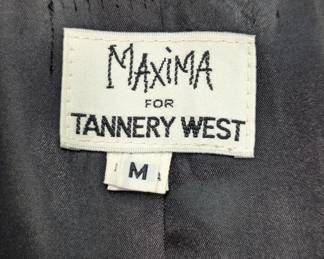 Closeup of tag inside Maxima vintage black leather long swing style coat, size M