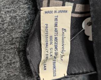 Closeup of a vintage 1984 100% silk scarf featuring a geometric pattern inspired by Frank Lloyd Wright's "Tree of Life" stained glass design, produced in Japan for The Fine Arts Museums of San Francisco