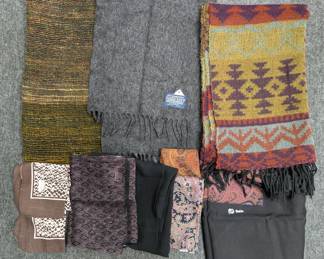 A collection of various scarves and wraps, including woven patterned alpaca wool scarf, patterned silk, and a Lands' End grey 100% lambswool scarf, 