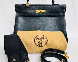 A classic vintage Hermès Kelly Retourne 32 handbag in black Ardennes leather, authenticated by Entrupy. It comes with a single rolled handle, a leather removable shoulder strap, an Hermès "sangle" wide woven strap, and a dust bag.
