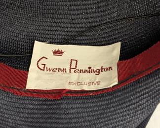 Closeup of vintage Gwenn Pennington gray fascinator hat with netting and blue feathers